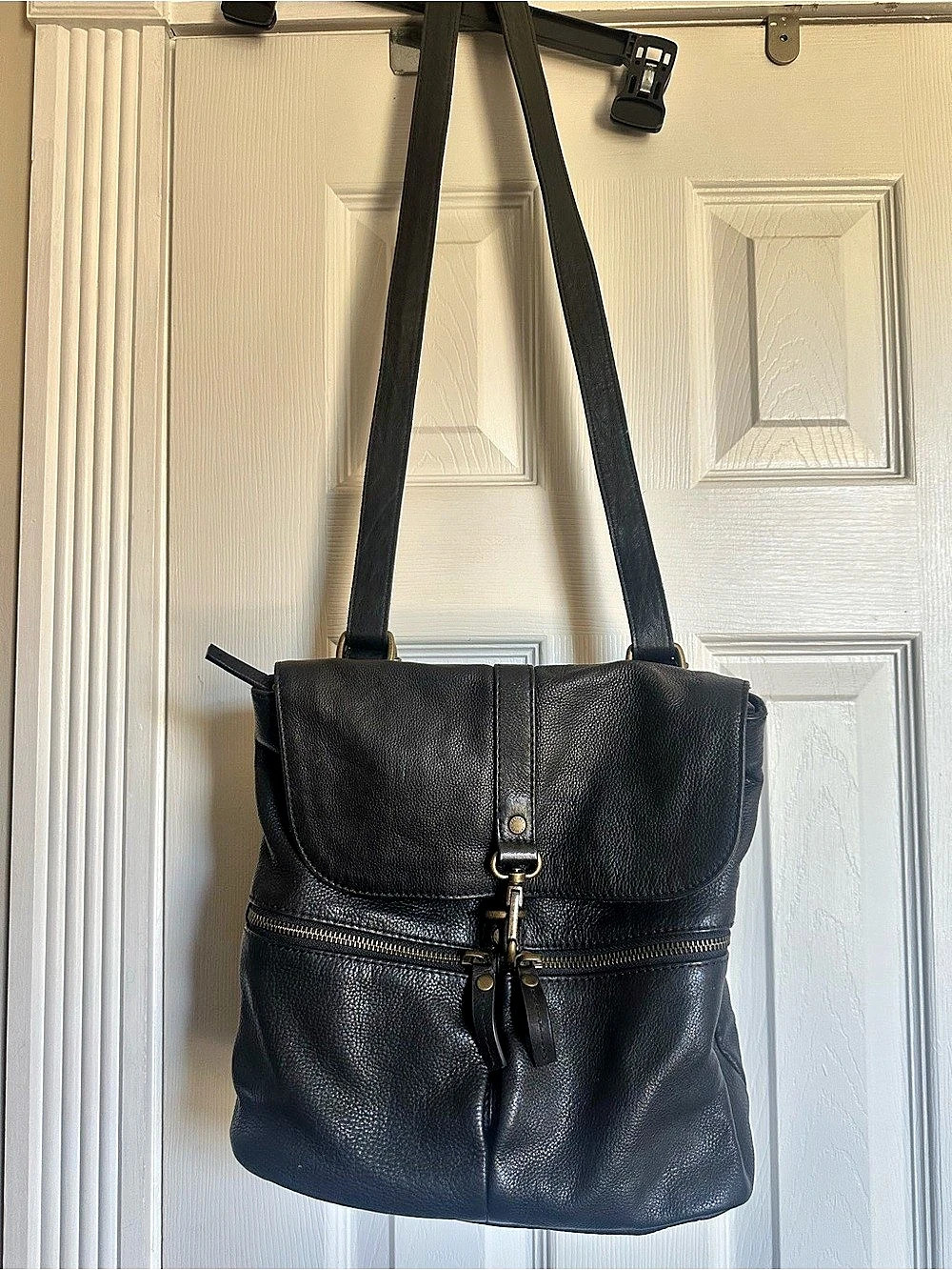 Black leather convertible backpack and shoulder bag.